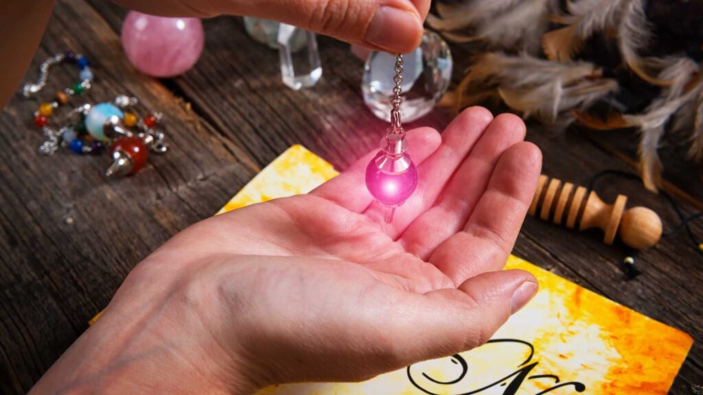 A person holding their hand out with a light in it.