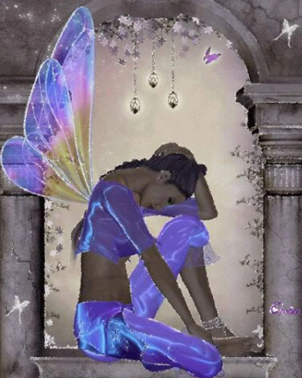 A fairy with wings is sitting on the ground.